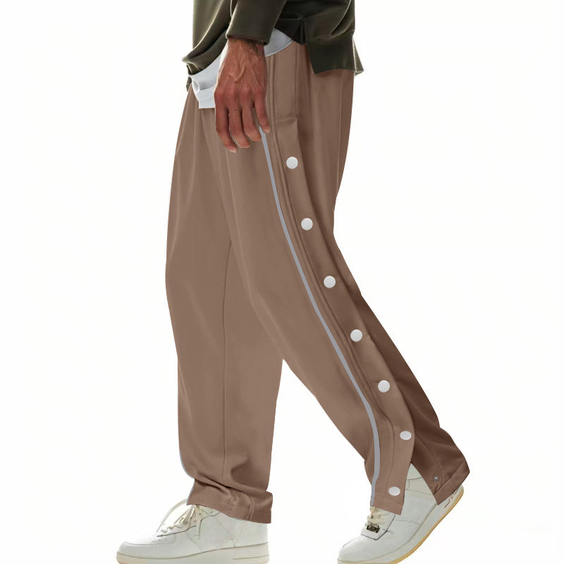 Herren nan weite Trackpants mit seitlicher Druckknopfleiste, elastischem Bund und reflektierendem Streamline-Streifen Drune